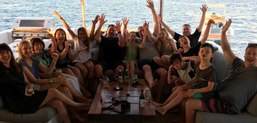 group posing on ocean dream catamaran
