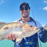 man holding a fish