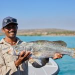 man holding a fish