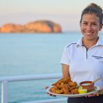 ocean dream team member holding a plate of food