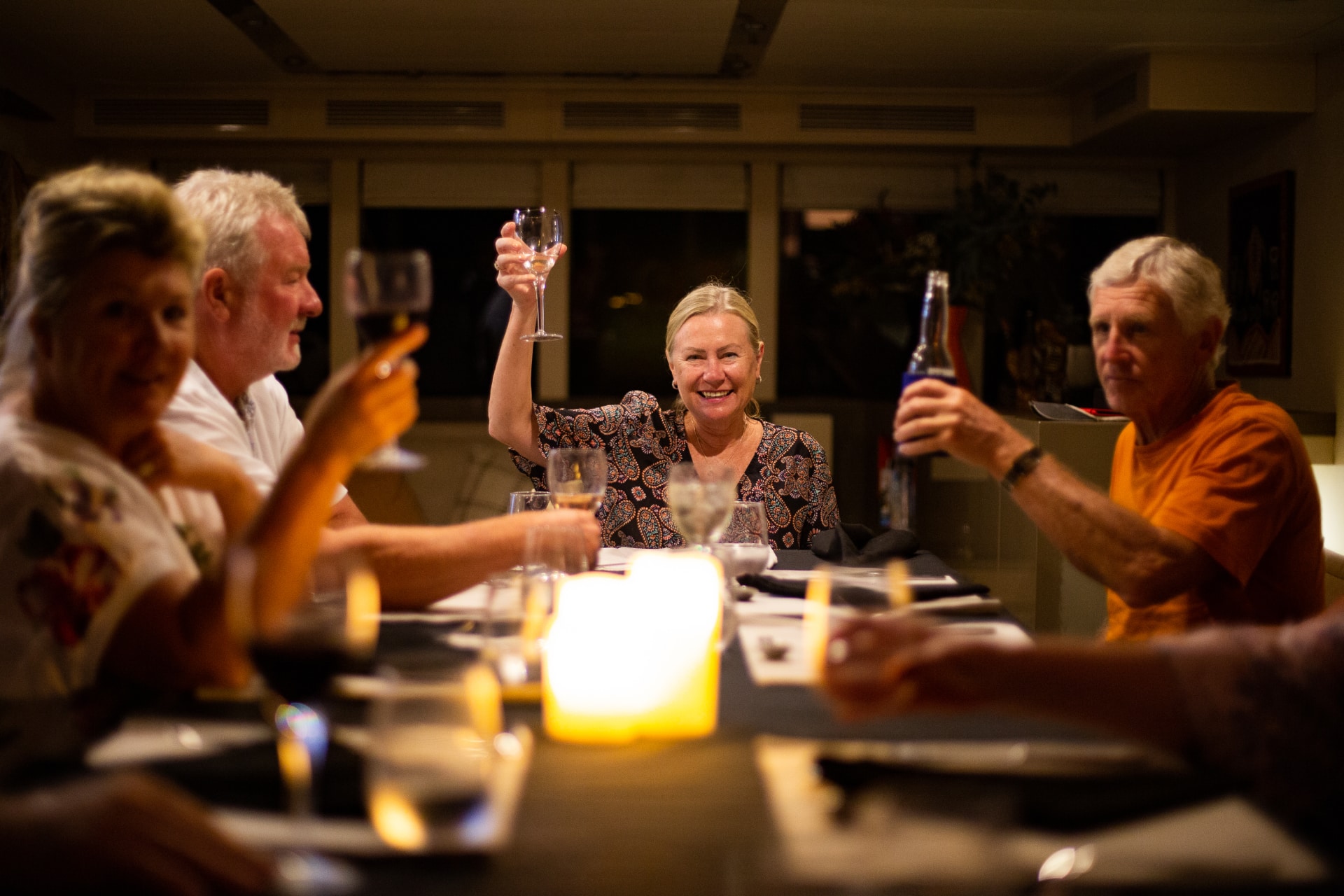 A group of people enjoying evening drinks on a Kimberley cruise