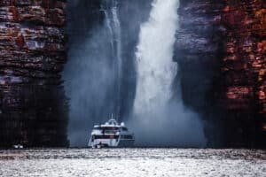 Kimberley cruise going next to a waterfall