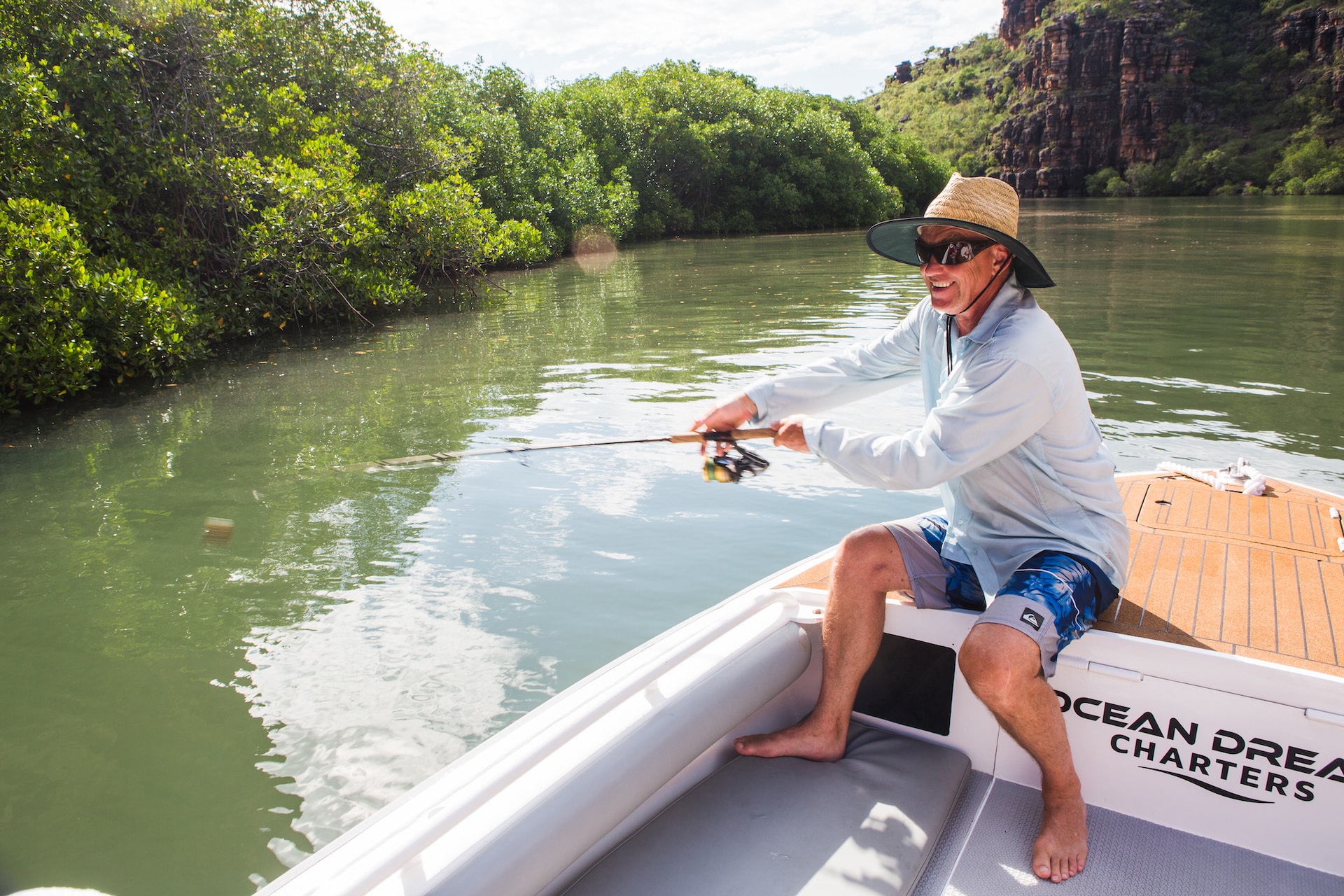 Man fishing on a small boat in the Kimberley